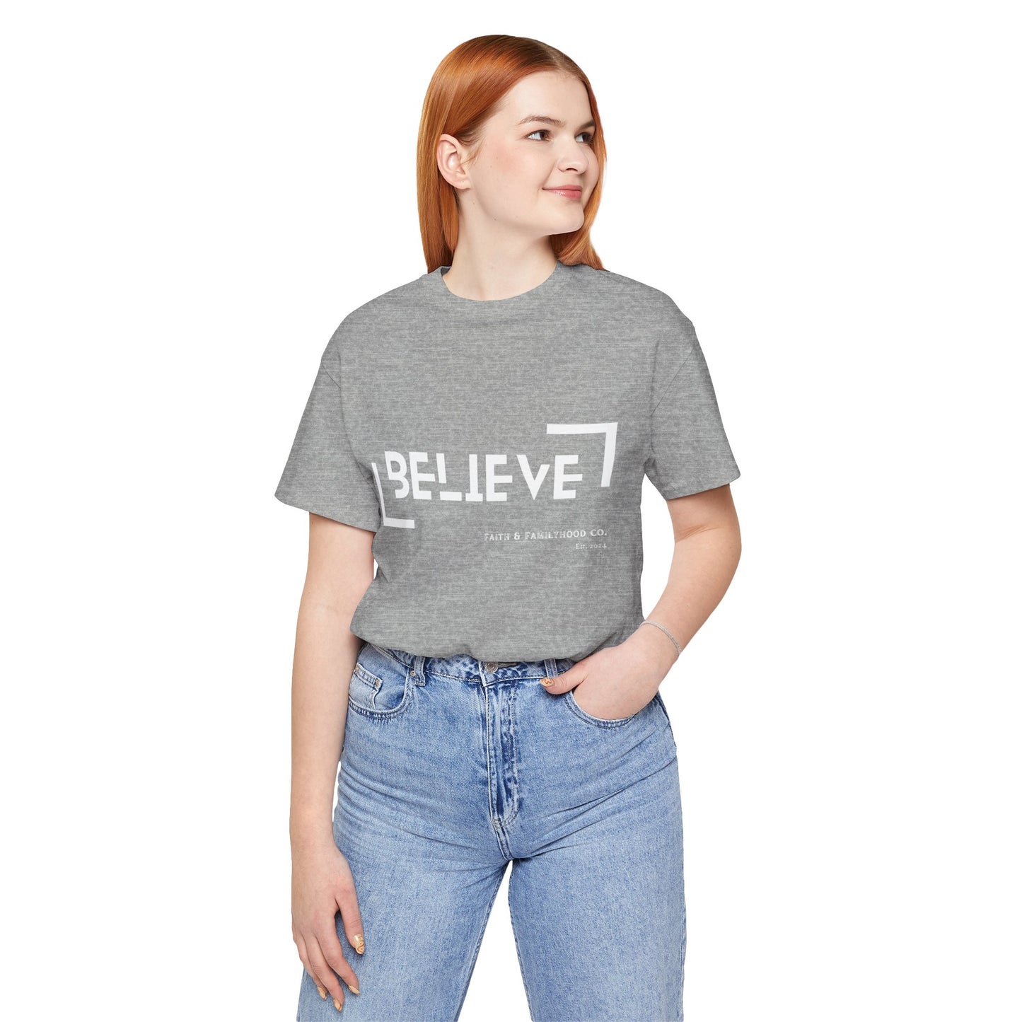 The photo displays a athletic heather Believe Shirt with a clean, modern design, highlighting the word "BELIEVE" and the established year of Faith & Familyhood Co., 2014.